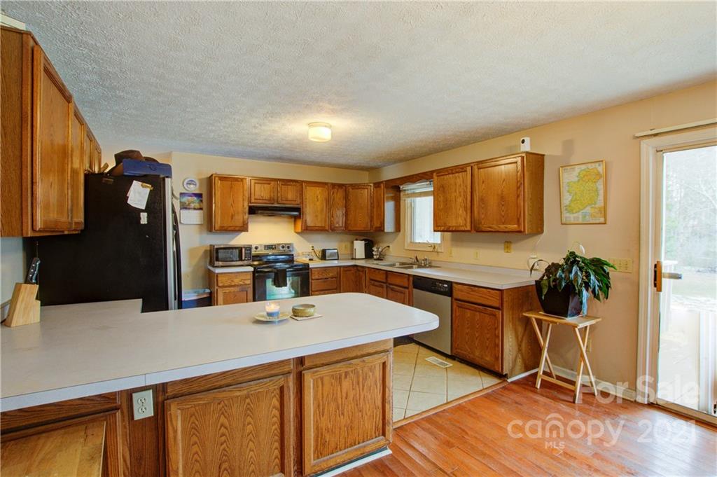 262 Spring Run Road Mooresville, NC 28117 - Photo 16 of 42 a kitchen with granite countertop a sink appliances cabinets and furniture