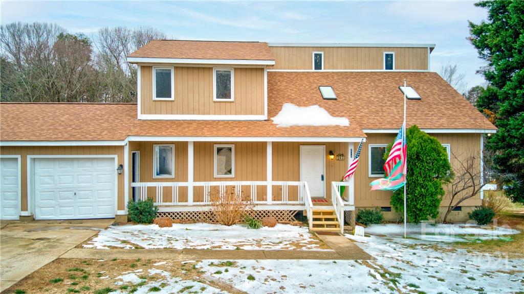 262 Spring Run Road Mooresville, NC 28117 - Photo 2 of 42 a front view of a house with a yard