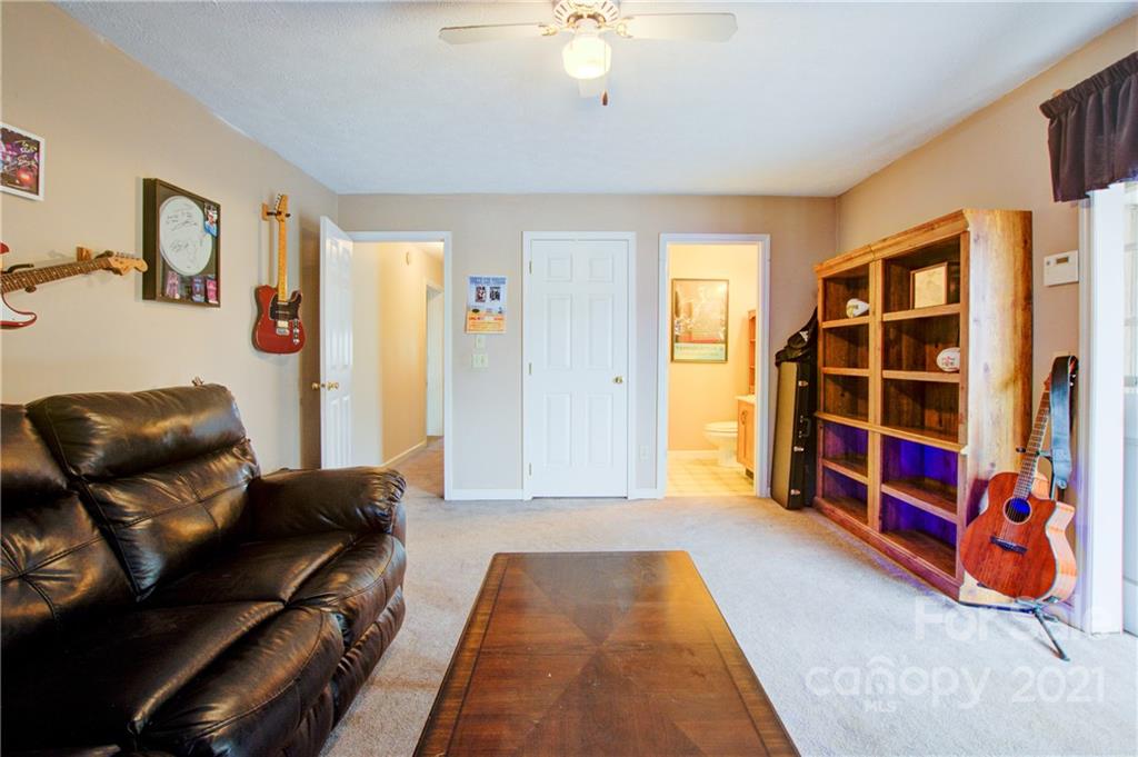 262 Spring Run Road Mooresville, NC 28117 - Photo 30 of 42 a bedroom with furniture and a book shelf