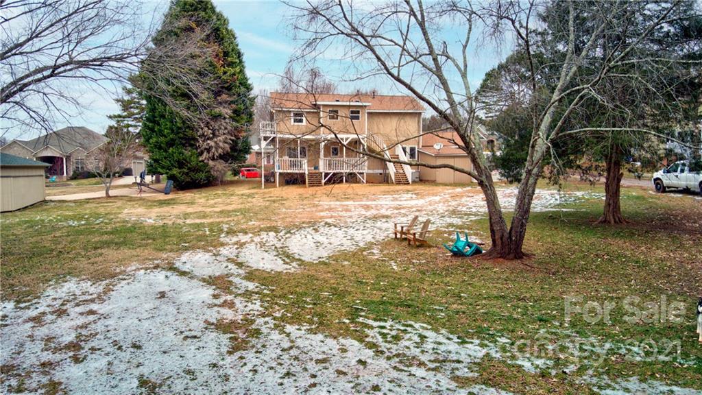262 Spring Run Road Mooresville, NC 28117 - Photo 6 of 42 a view of a yard with a house and large trees