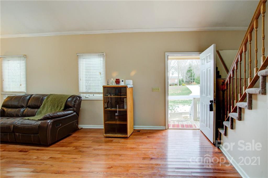 262 Spring Run Road Mooresville, NC 28117 - Photo 10 of 42 a living room with furniture and a wooden floor