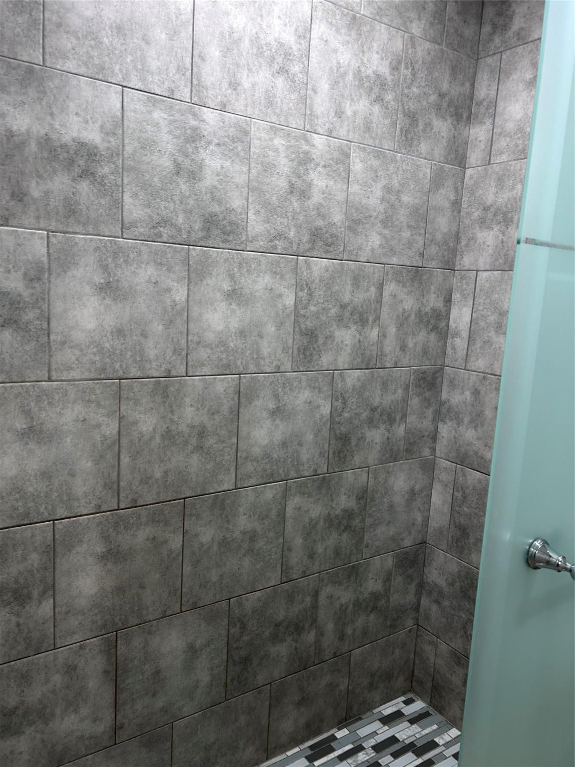 1212 Alamo Street Rosenberg, TX 77471 - Photo 16 of 34 a bathroom with a shower