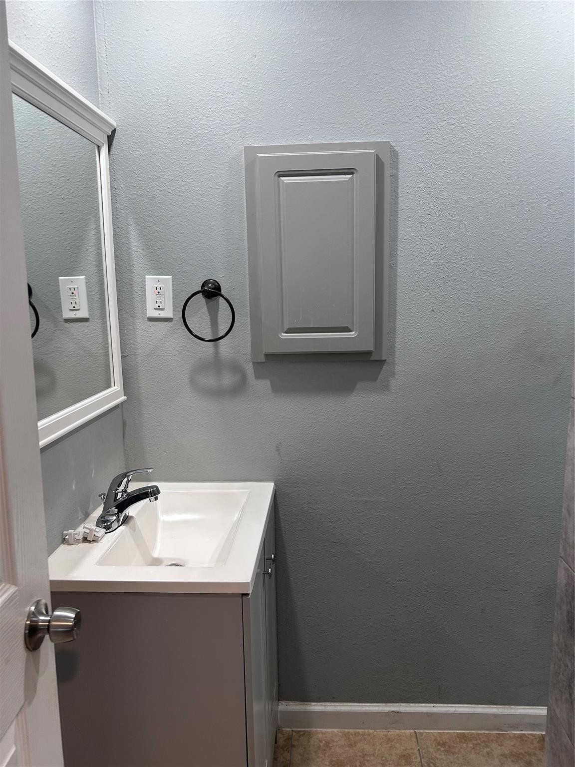 1212 Alamo Street Rosenberg, TX 77471 - Photo 19 of 34 a bathroom with a sink and mirror