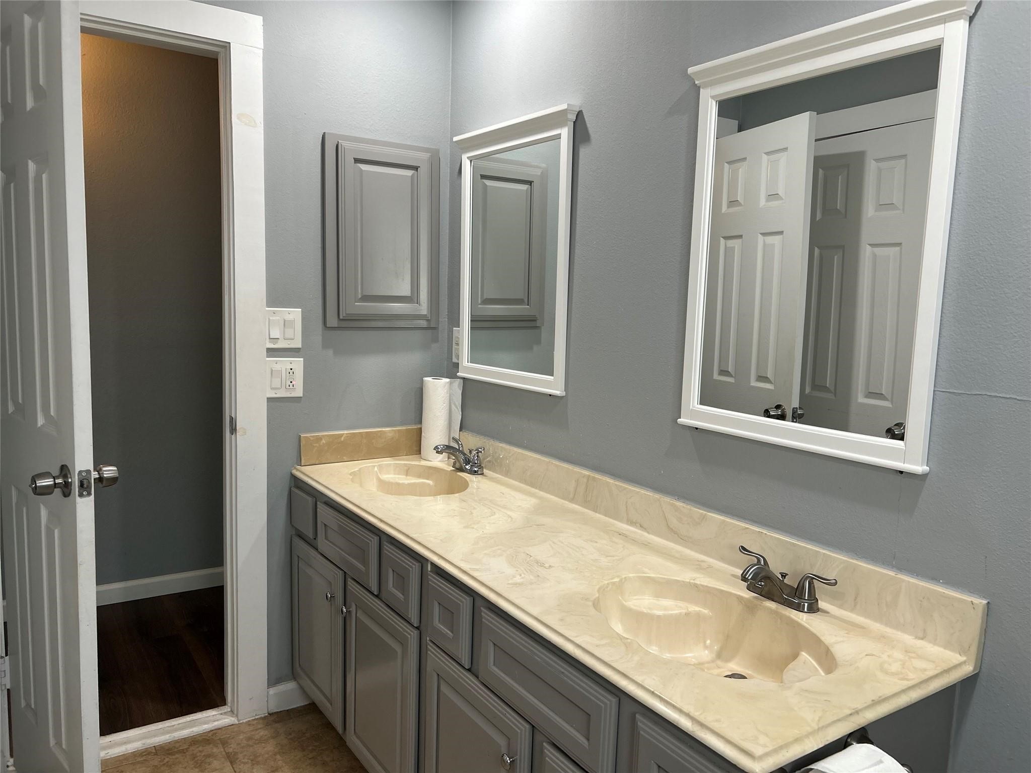 1212 Alamo Street Rosenberg, TX 77471 - Photo 24 of 34 a bathroom with a sink and a mirror