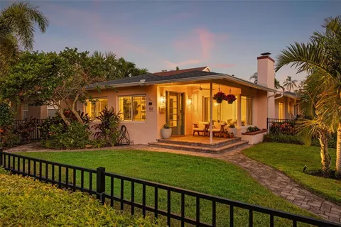 a view of a house with a yard porch and sitting area