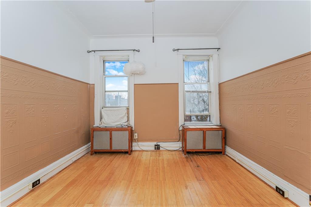 464 73rd Street Brooklyn, NY 11209 - Photo 8 of 37 an empty room with windows
