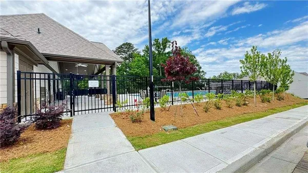 a view of swimming pool with a yard