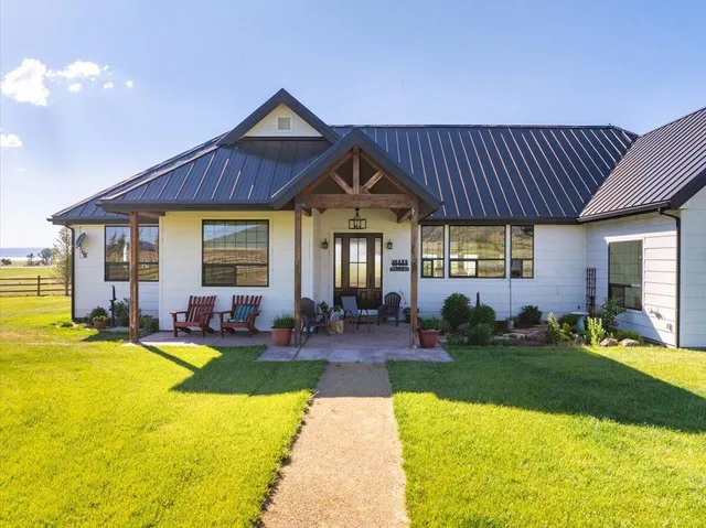 a kitchen with lots of counter top space and dining table