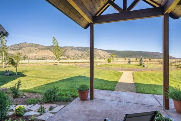 a kitchen with a sink window and cabinets