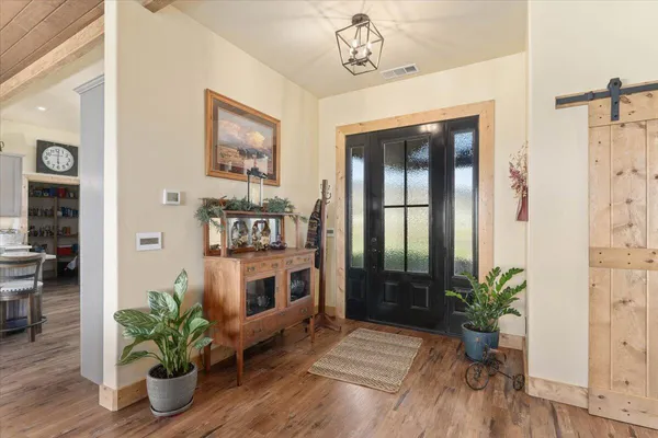 a living room with furniture a fireplace and a window