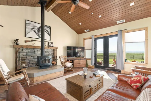 a spacious bedroom with a bed and a large window