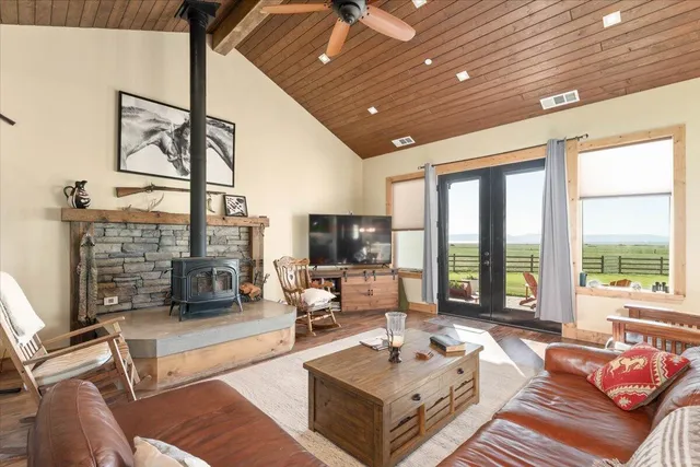 a spacious bedroom with a bed and a large window