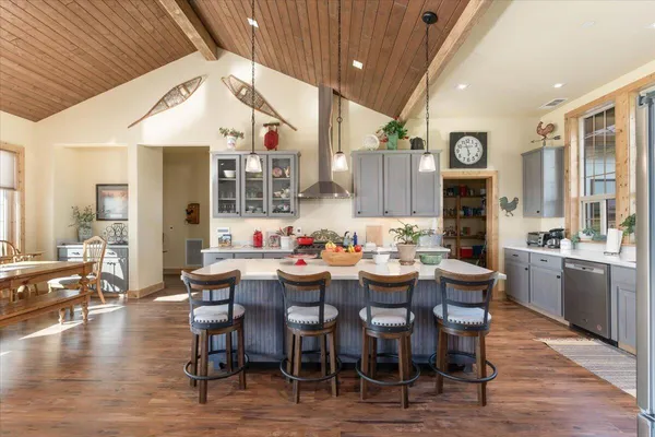 a bathroom with a granite countertop sink and a window