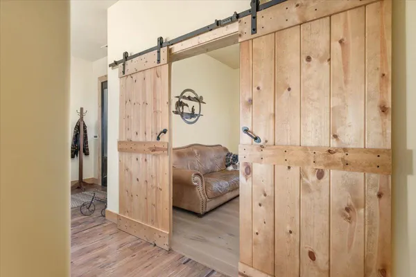 a swimming pool with lots of trees in the background
