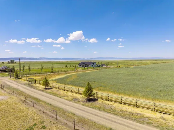a living room with furniture a fireplace and a table