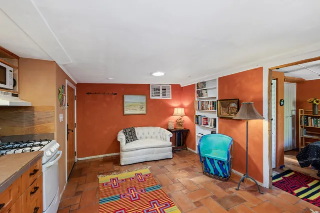 a bedroom with furniture and a flat screen tv