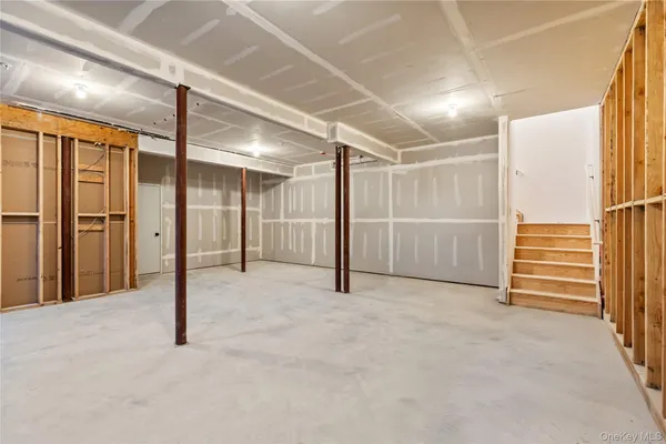 a view of empty room with wooden walls