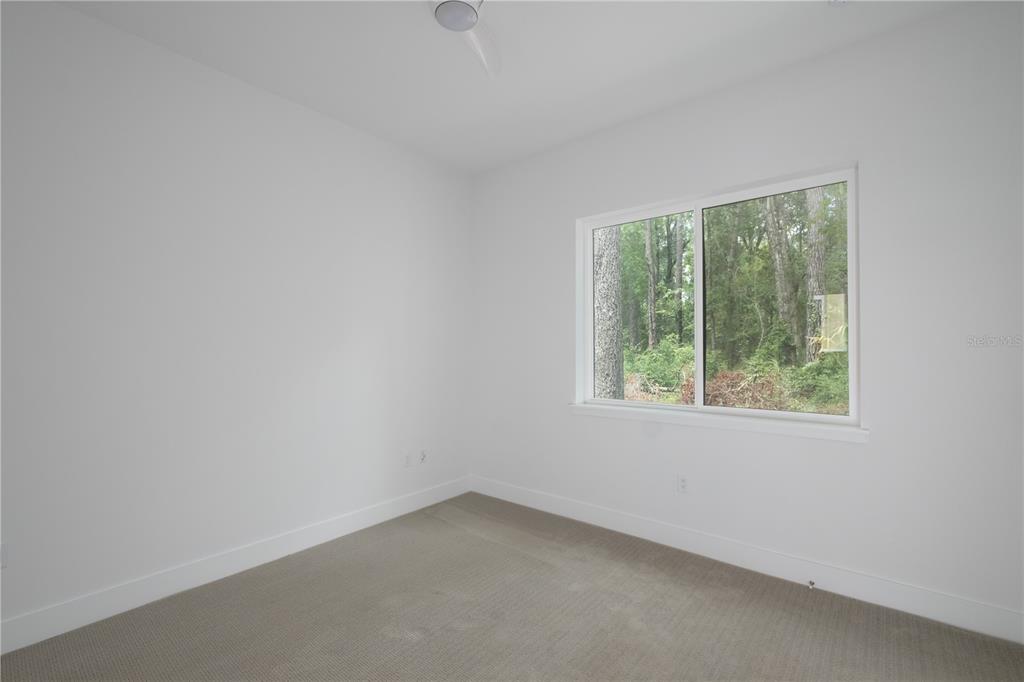 2601 Southwest Williston Road, Unit 9 Gainesville, FL 32608 - Photo 14 of 35 an empty room with a window