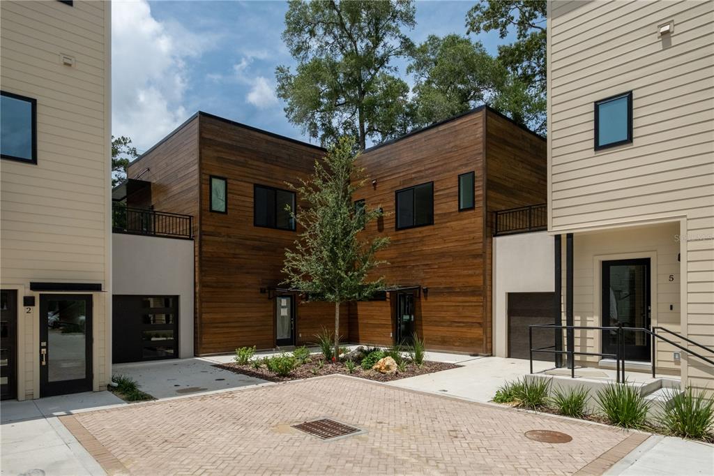 2601 Southwest Williston Road, Unit 9 Gainesville, FL 32608 - Photo 29 of 35 a front view of a house with yard