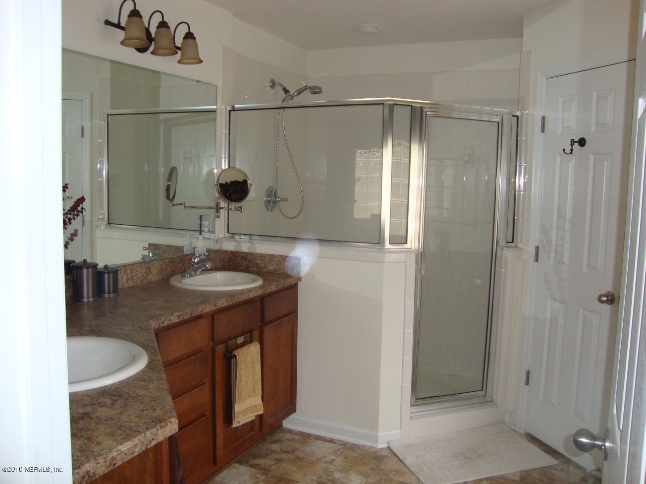 9129 Raptor Drive Jacksonville, FL 32221 - Photo 14 of 32 a bathroom with a granite countertop shower sink and mirror