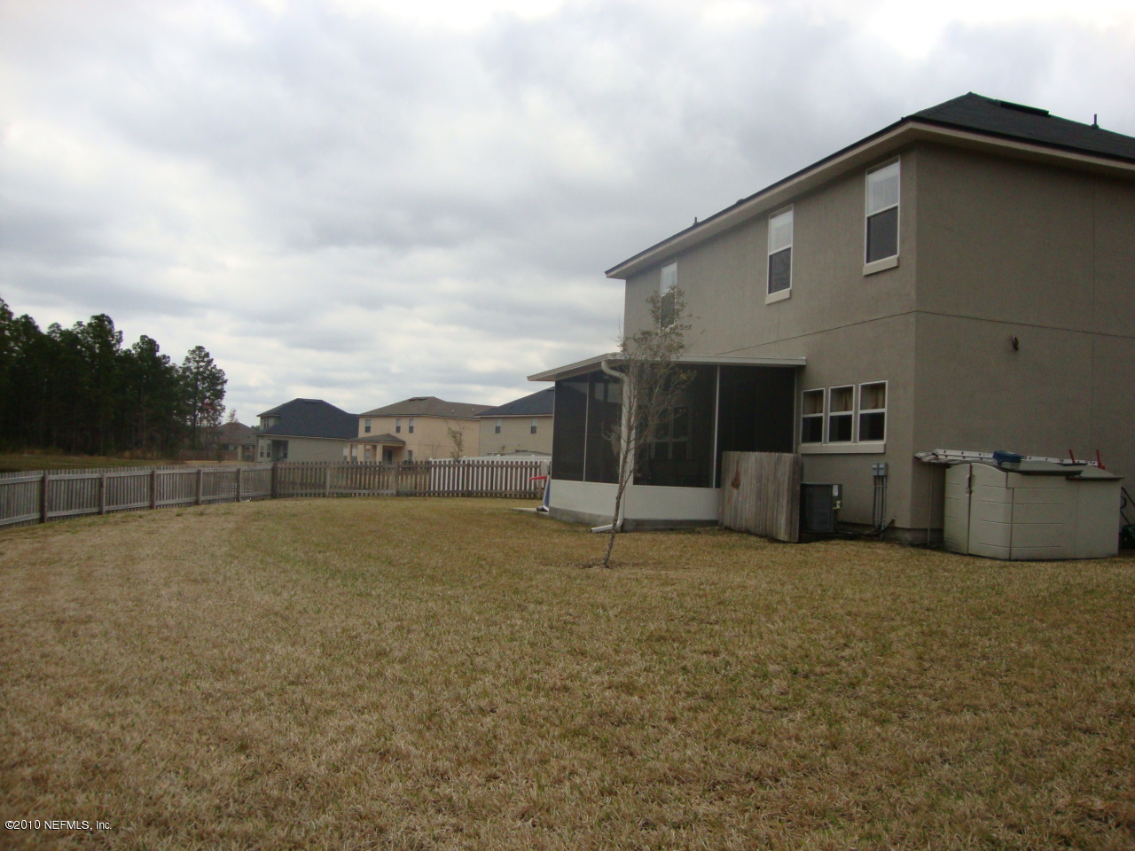 9129 Raptor Drive Jacksonville, FL 32221 - Photo 24 of 32 a view of a house with a yard