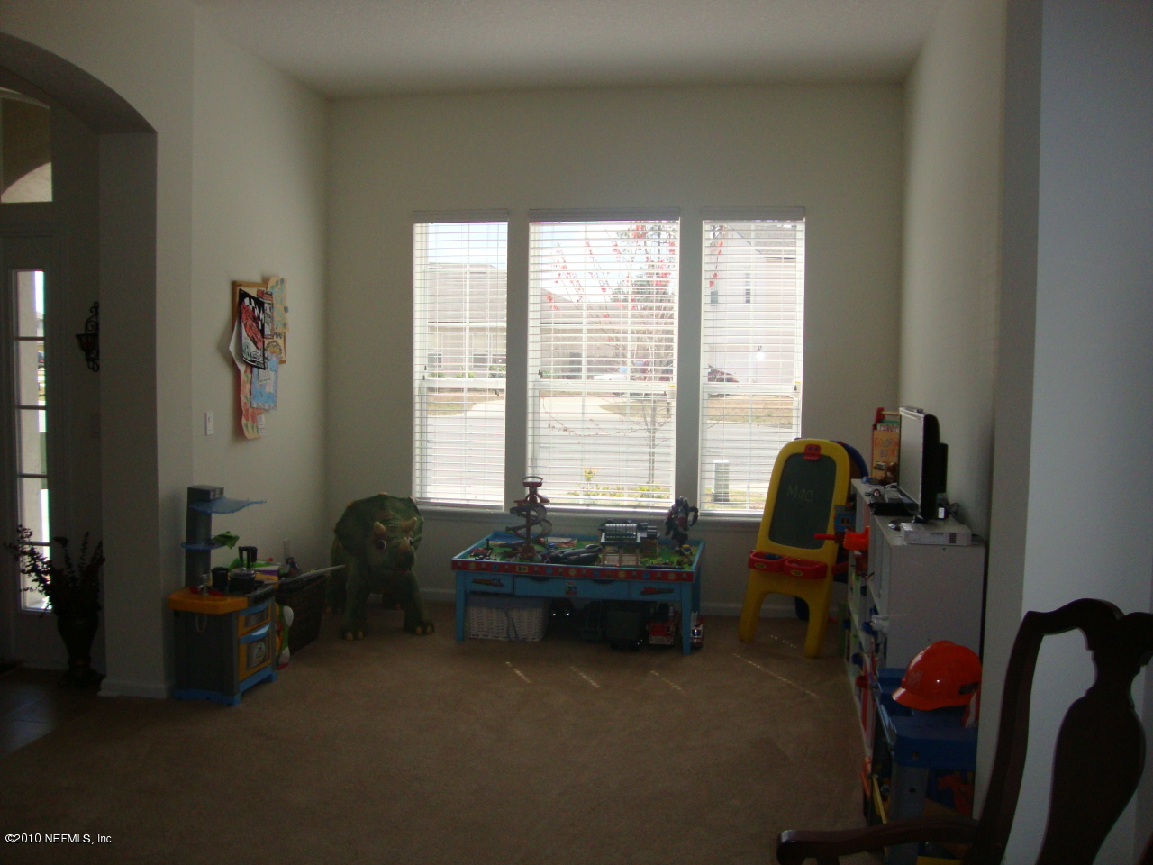 9129 Raptor Drive Jacksonville, FL 32221 - Photo 9 of 32 a room with furniture and a window