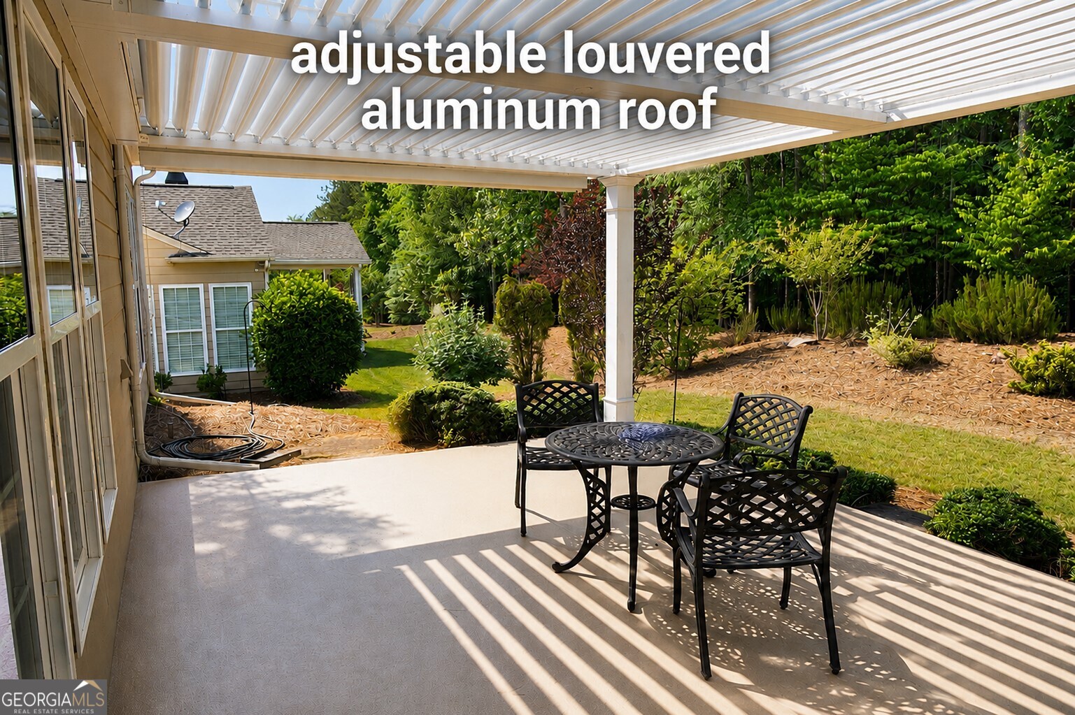 1211 Water Front Road Greensboro, GA 30642 - Photo 13 of 40 a view of a patio with table and chairs near a garden