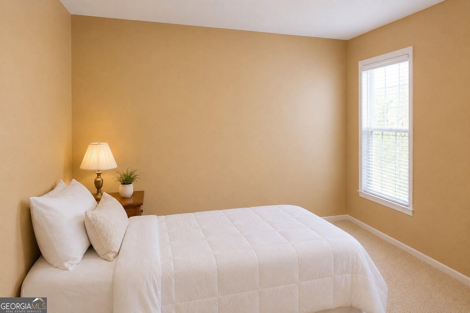1211 Water Front Road Greensboro, GA 30642 - Photo 17 of 40 a bedroom with a bed and a window