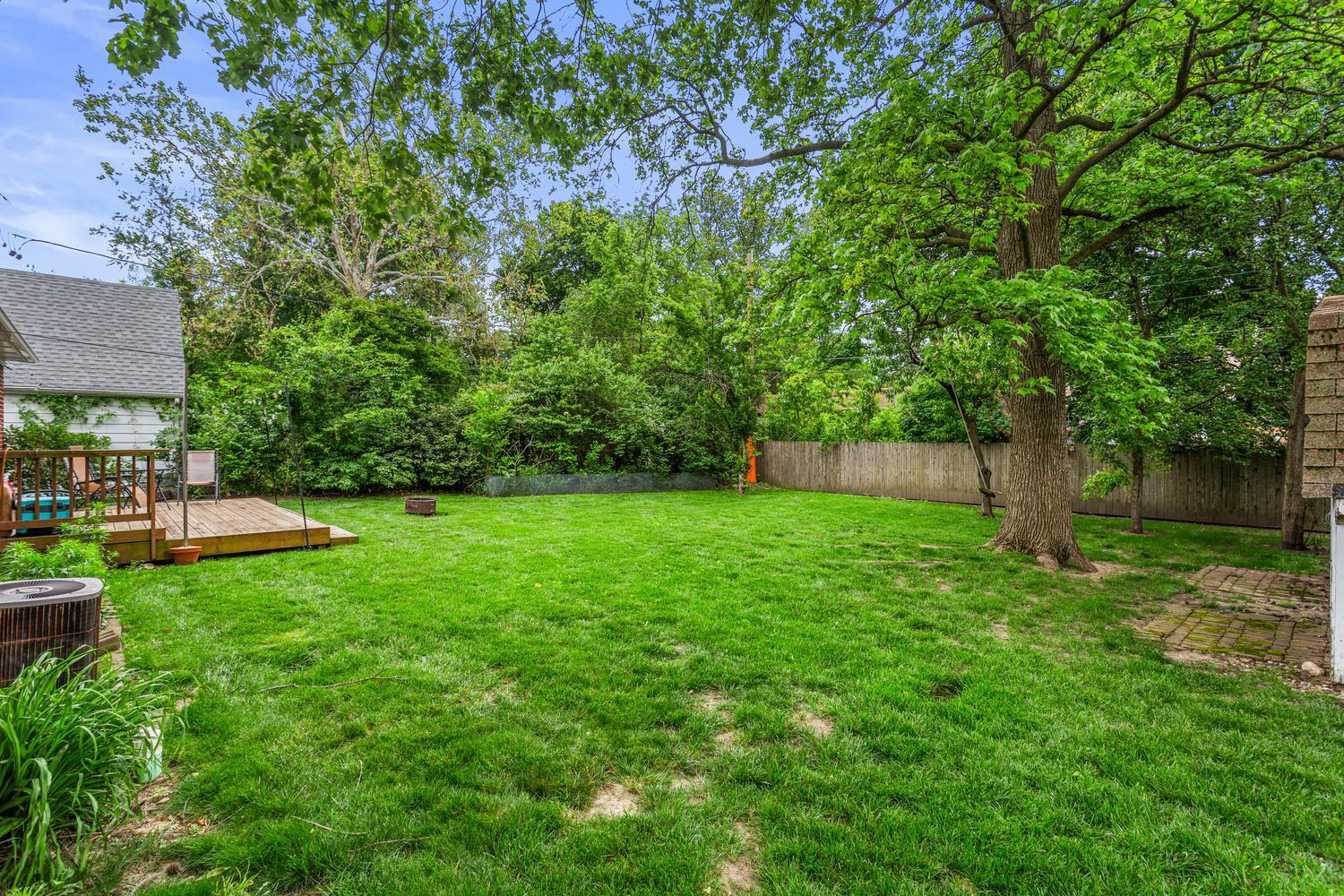 1117 West Union Street Champaign, IL 61821 - Photo 8 of 29 a view of a chair and table on the green field