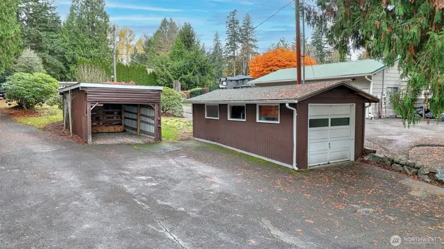 a view of a house with a yard and a fireplace
