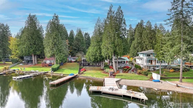 a view of a lake with a house in the background