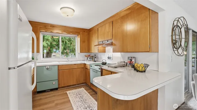 a kitchen with a sink and cabinets