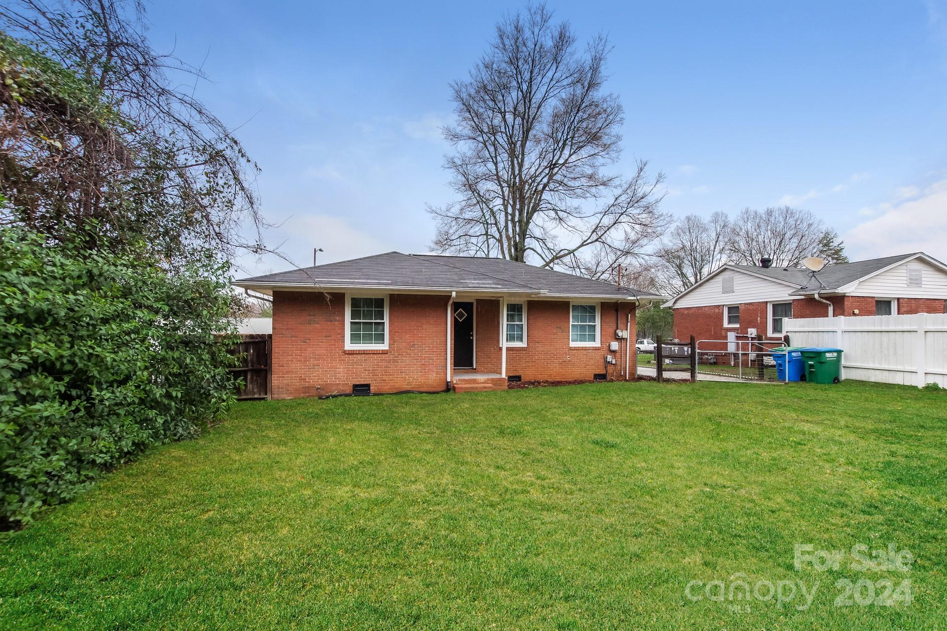 123 Boatright Road Pineville, NC 28134 - Photo 15 of 15 a front view of a house with a garden
