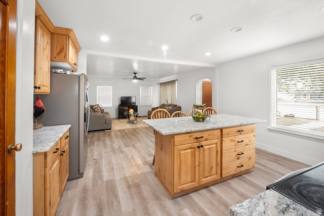 3885 West 4500 S Road Delta, UT 84624 - Photo 14 of 24 Kitchen featuring an island with stone countertops, wood cabinetry, and recessed lighting