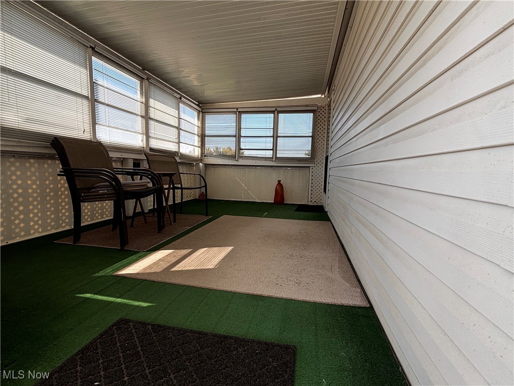 18592 Edwards Road, Unit 137 Doylestown, OH 44230 - Photo 4 of 17 Unfurnished sunroom with plenty of natural light