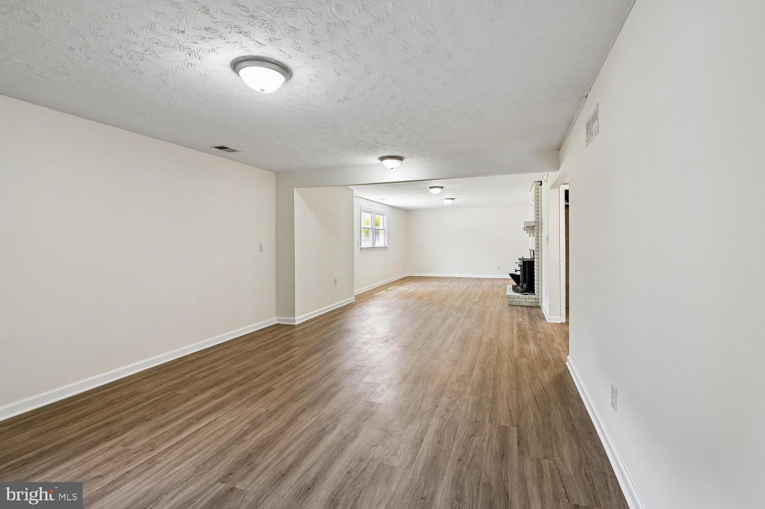 7879 Elizabeth Road Pasadena, MD 21122 - Photo 31 of 36 Recreation Room with New LVP