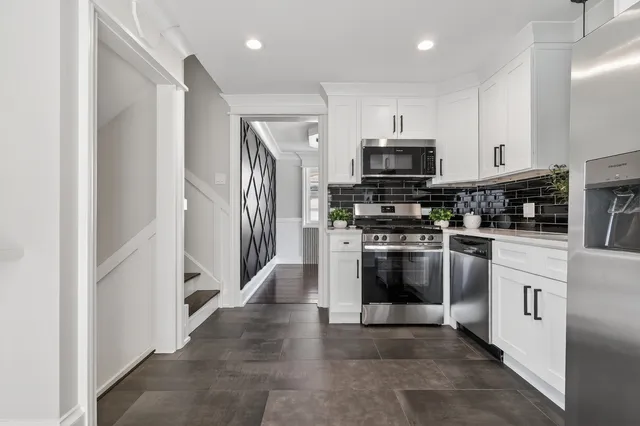 a view of a kitchen with wooden floor