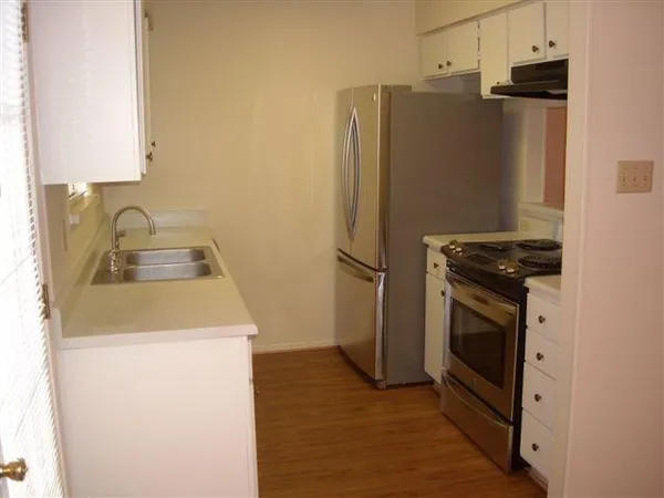 a view of empty room with windows