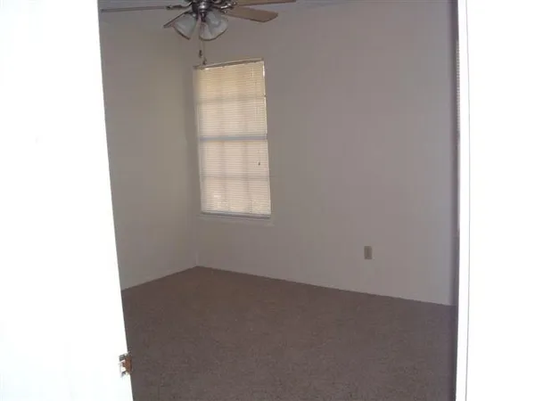 a bathroom with a shower and toilet