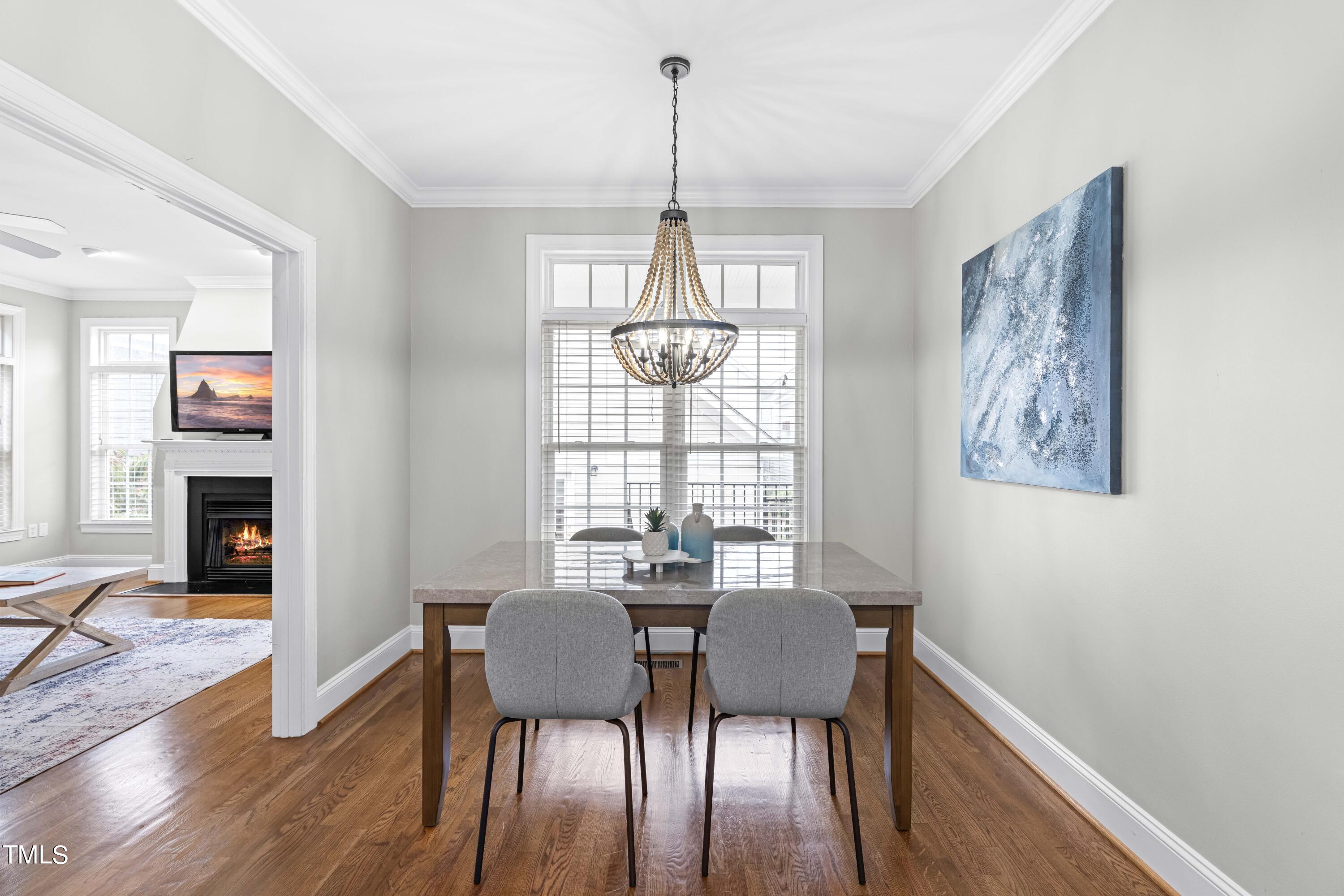 1136 Harp Street Raleigh, NC 27604 - Photo 13 of 42 a view of a dining room with furniture window and wooden floor