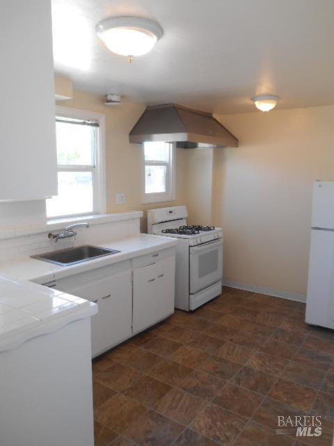 1020 Bennett Valley Road Santa Rosa, CA 95404 - Photo 15 of 24 a kitchen with a sink stove and cabinets