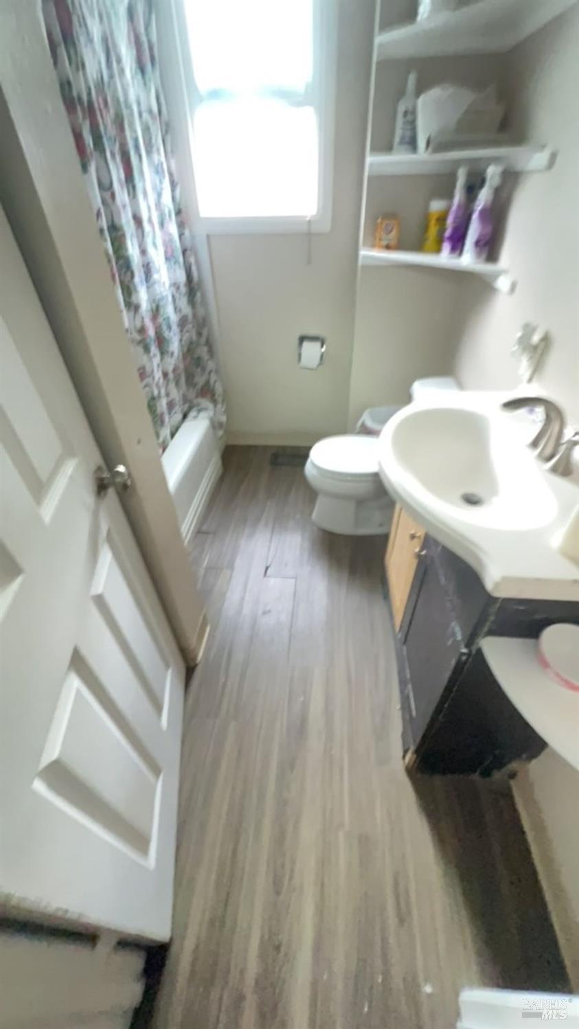 1020 Bennett Valley Road Santa Rosa, CA 95404 - Photo 19 of 24 a bathroom with a sink and toilet