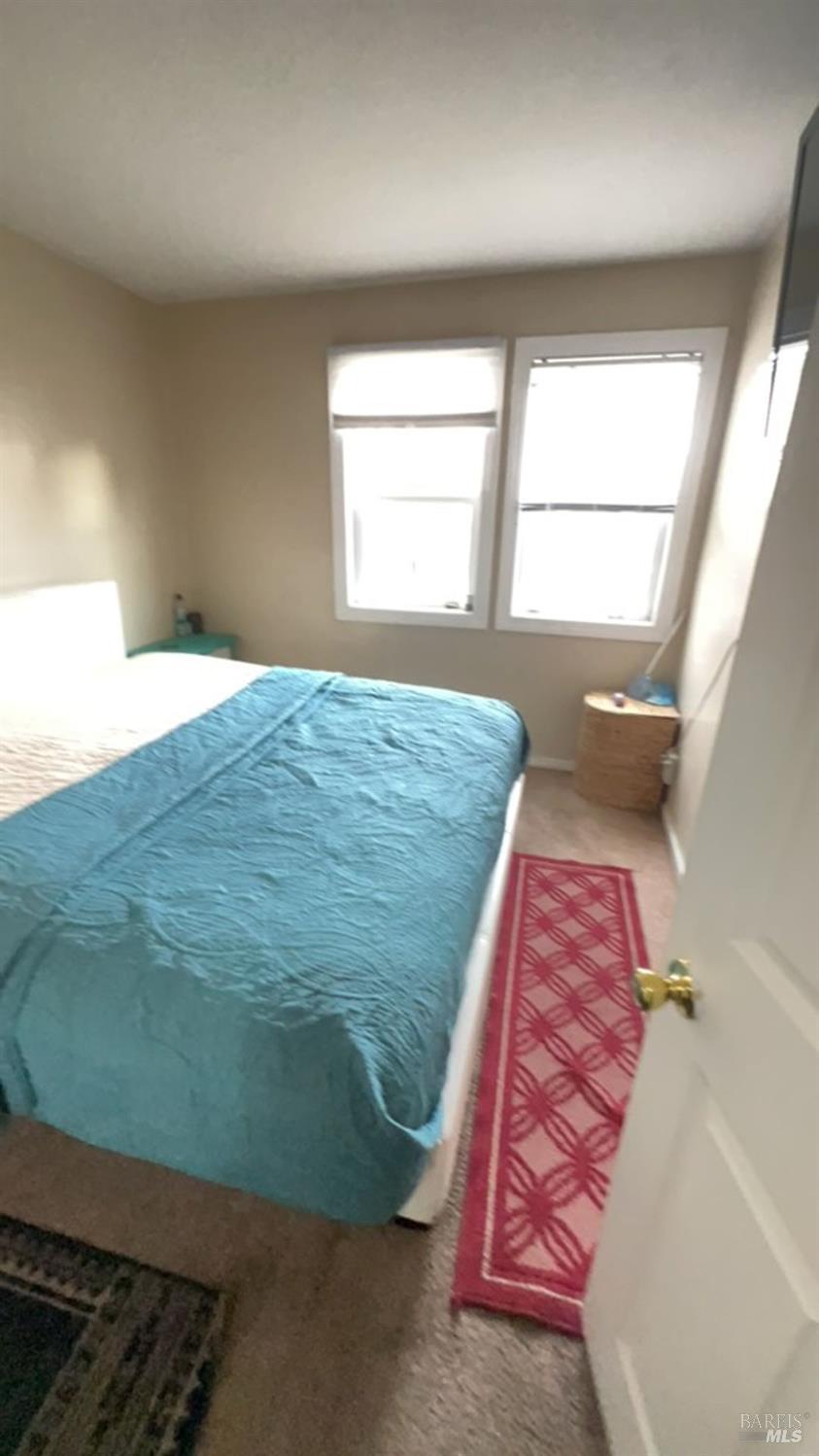 1020 Bennett Valley Road Santa Rosa, CA 95404 - Photo 23 of 24 a bedroom with a bed and window