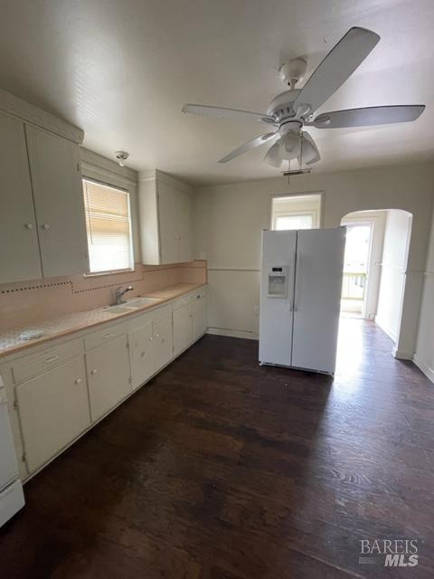 1020 Bennett Valley Road Santa Rosa, CA 95404 - Photo 5 of 24 a view of a kitchen with a sink and dishwasher with wooden floor