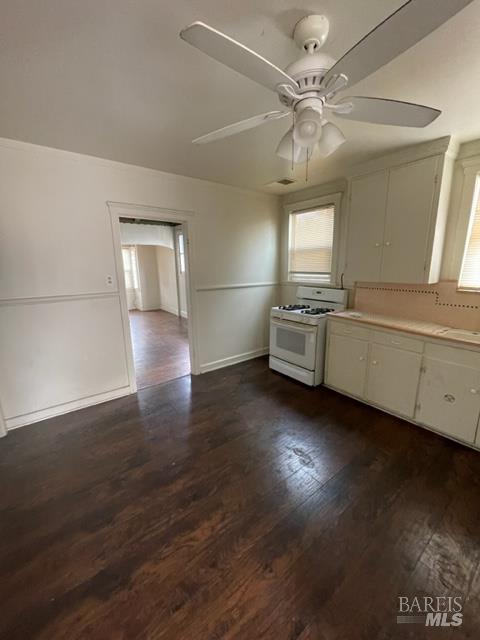 1020 Bennett Valley Road Santa Rosa, CA 95404 - Photo 6 of 24 a kitchen with stove cabinets and wooden floor