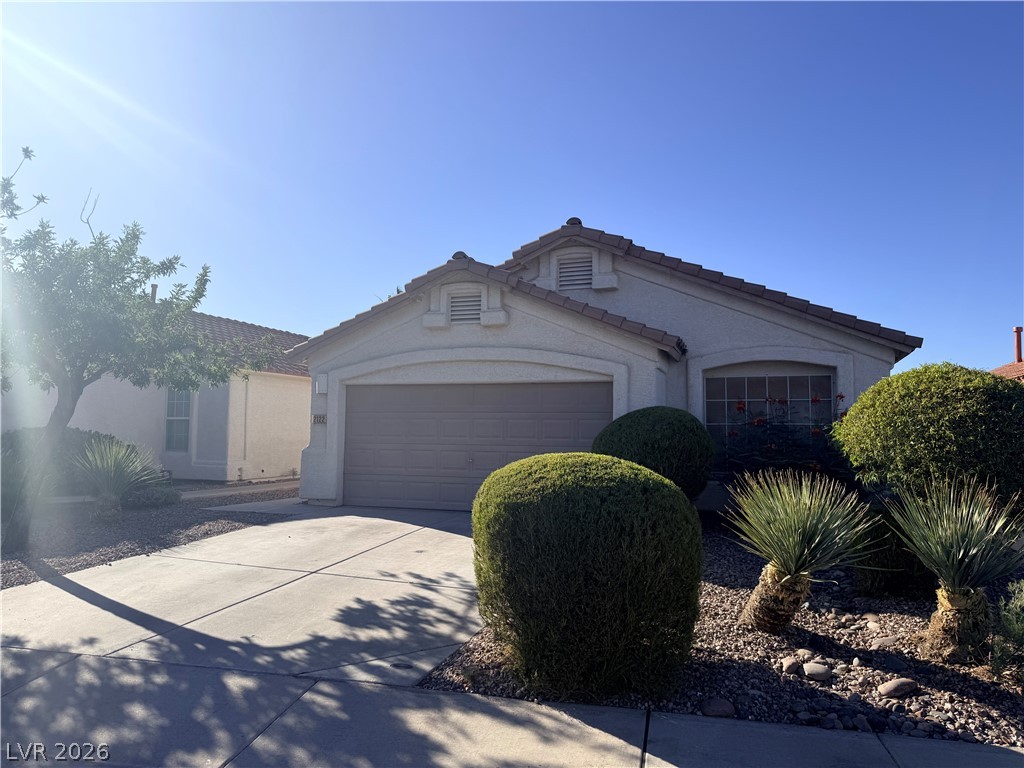 2122 Hidden Ranch Terrace Henderson, NV 89052 - Photo 5 of 20 Well-kept landscape frames a charming facade and a spacious driveway leading to the integrated garage.