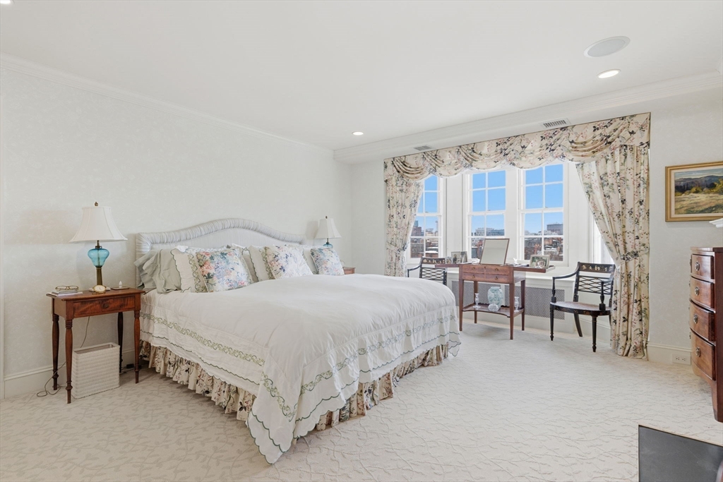 81 Beacon Street, Unit 8 Boston, MA 02108 - Photo 15 of 32 a bedroom with a bed and a table