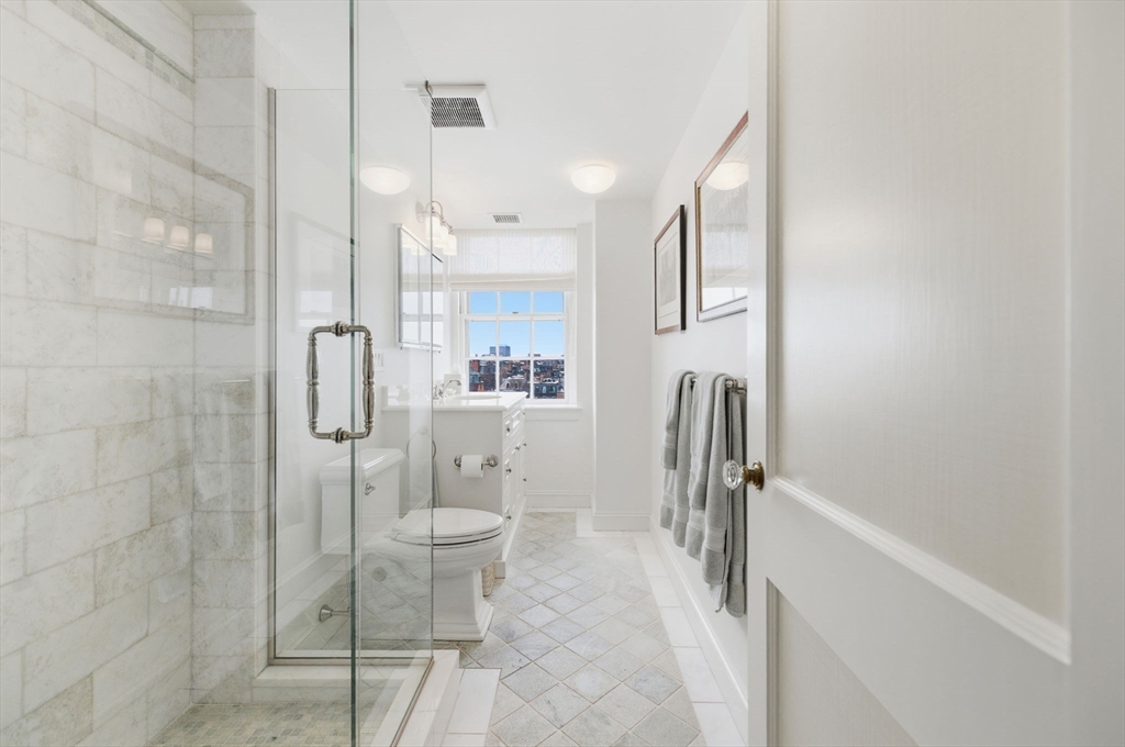 81 Beacon Street, Unit 8 Boston, MA 02108 - Photo 18 of 32 a bathroom with a shower and a toilet