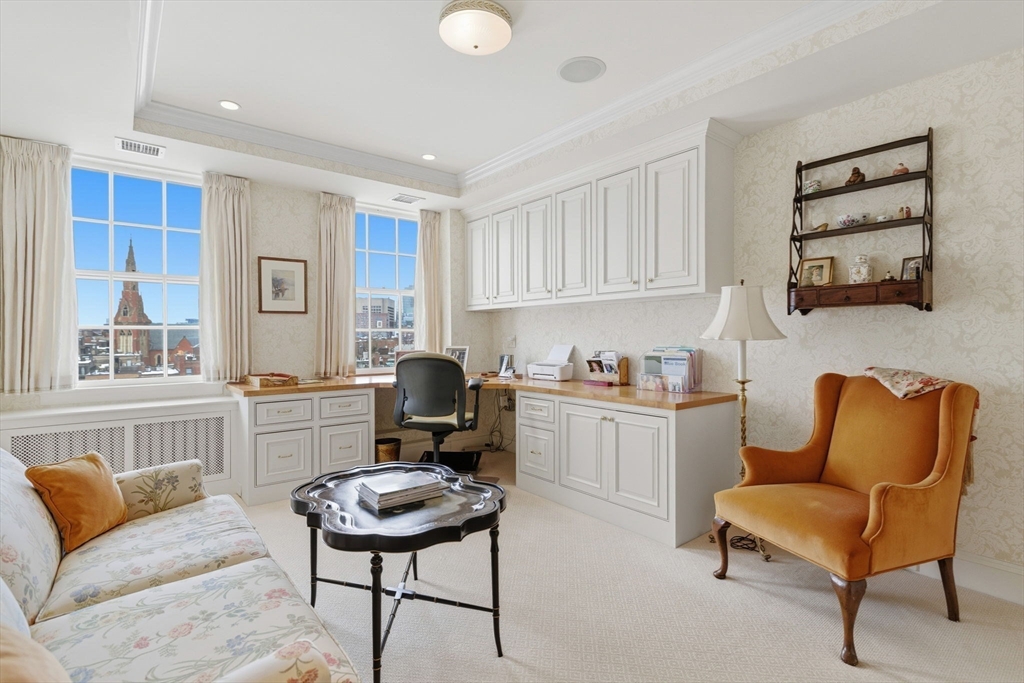 81 Beacon Street, Unit 8 Boston, MA 02108 - Photo 19 of 32 a living room with furniture a rug kitchen view and a window
