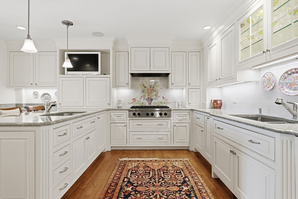81 Beacon Street, Unit 8 Boston, MA 02108 - Photo 8 of 32 a kitchen with granite countertop white cabinets and white appliances